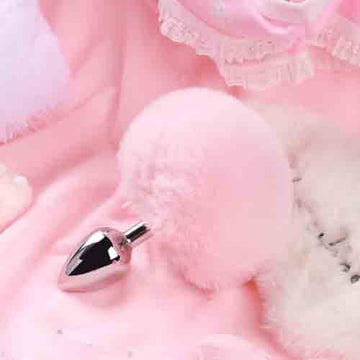 Pink stainless steel bunny tail butt plug with fluffy pink pom detail