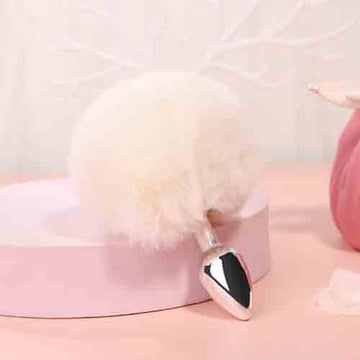 White fluffy bunny tail anal plug with pointed stainless steel tip