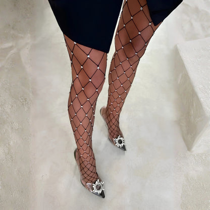 Rhinestone fishnet pantyhose with full-length diamond mesh, silver stones, and pointed heels