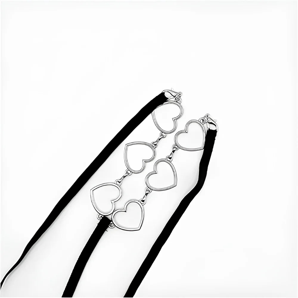Black thong with silver heart charm chain detail across the front