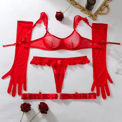 Red lingerie set flat lay: bra, garter straps, thong, stockings, and long gloves