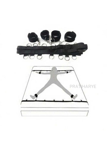Black fabric bed restraints set with wrist cuffs, ankle cuffs, and metal rings