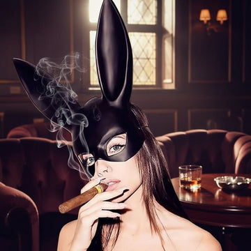 Black glossy bunny face mask with long ears, eye cutouts, and nose opening.