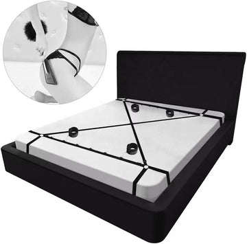 Black multi-position bed restraint system with cross straps on a mattress